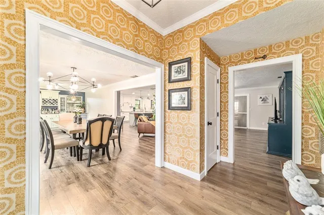 a view of a dining room with furniture and wooden floor