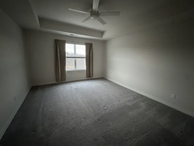 a view of empty room with windows