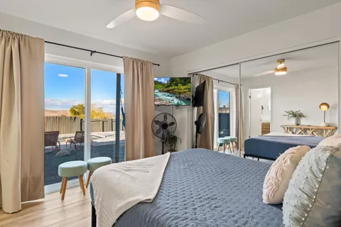 a bed room with a bed and a mirror