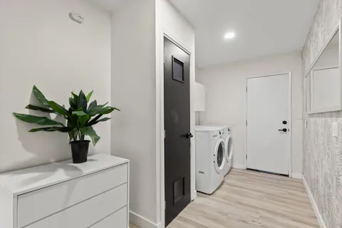 a view of hallway with washer and dryer