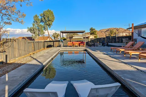 a view of a balcony with chairs