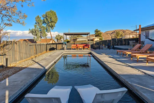 a view of a balcony with chairs