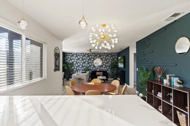 a bed room with a bed and a large window