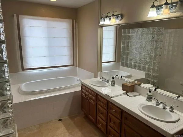 a bathroom with a bathtub and shower