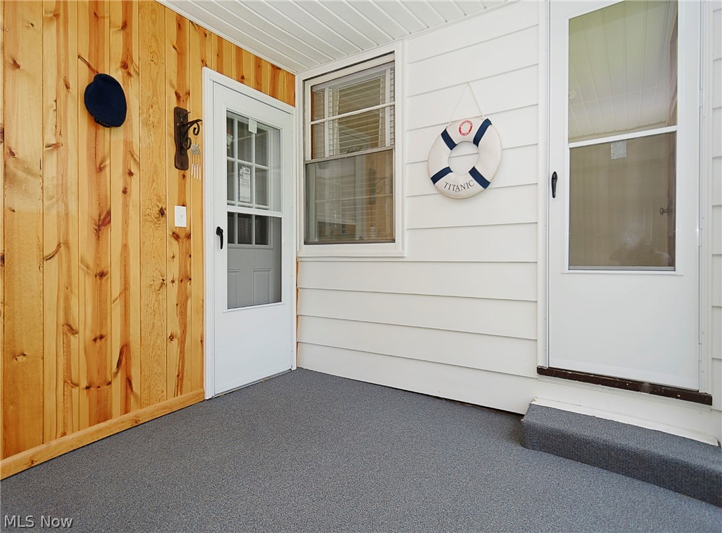14077 Alexander Road Bedford, OH 44146 - Photo 21 of 31 Newer garage back doors and house door in the 11½'x9½' three season room.