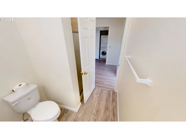 a open kitchen with sink and a refrigerator