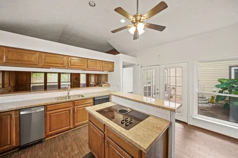 a kitchen with a stove a sink and a refrigerator