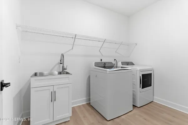 a utility room with dryer and washer