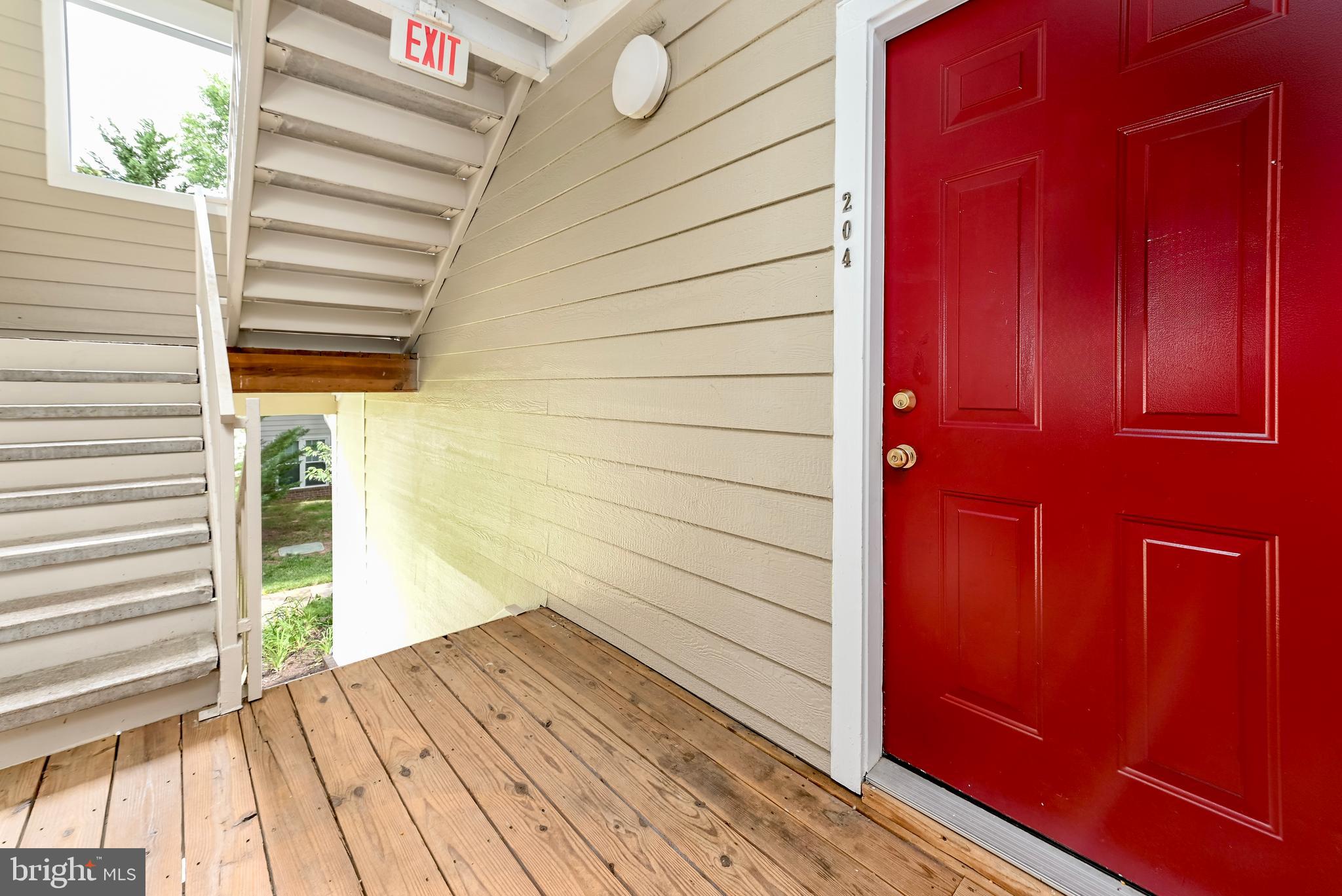 20991 Timber Ridge Terrace, Unit 204 Ashburn, VA 20147 - Photo 27 of 27 Front Door And Exterior Hallway