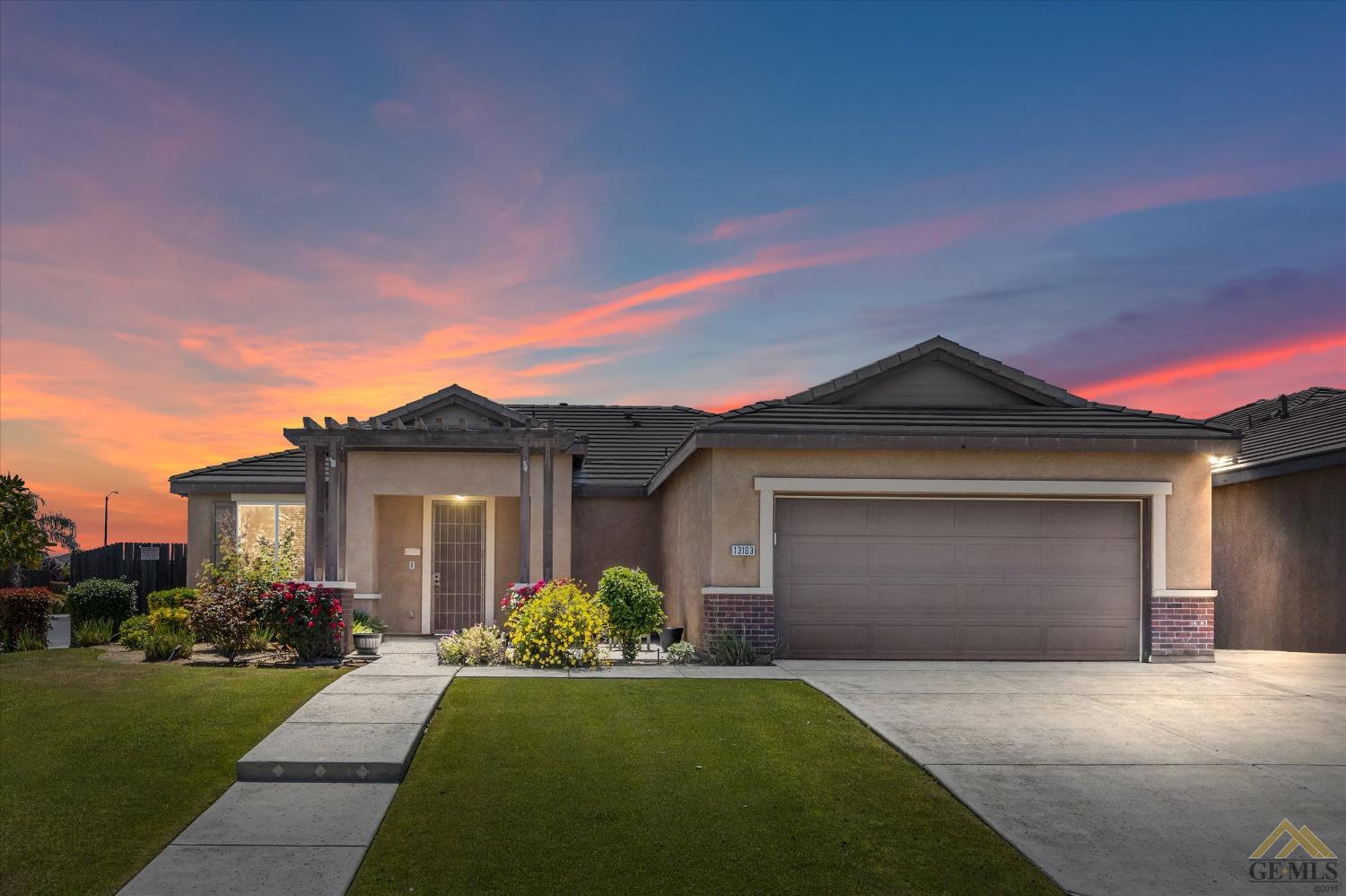 Undisclosed Address Bakersfield, CA 93314 - Photo 2 of 28 a front view of a house with a yard