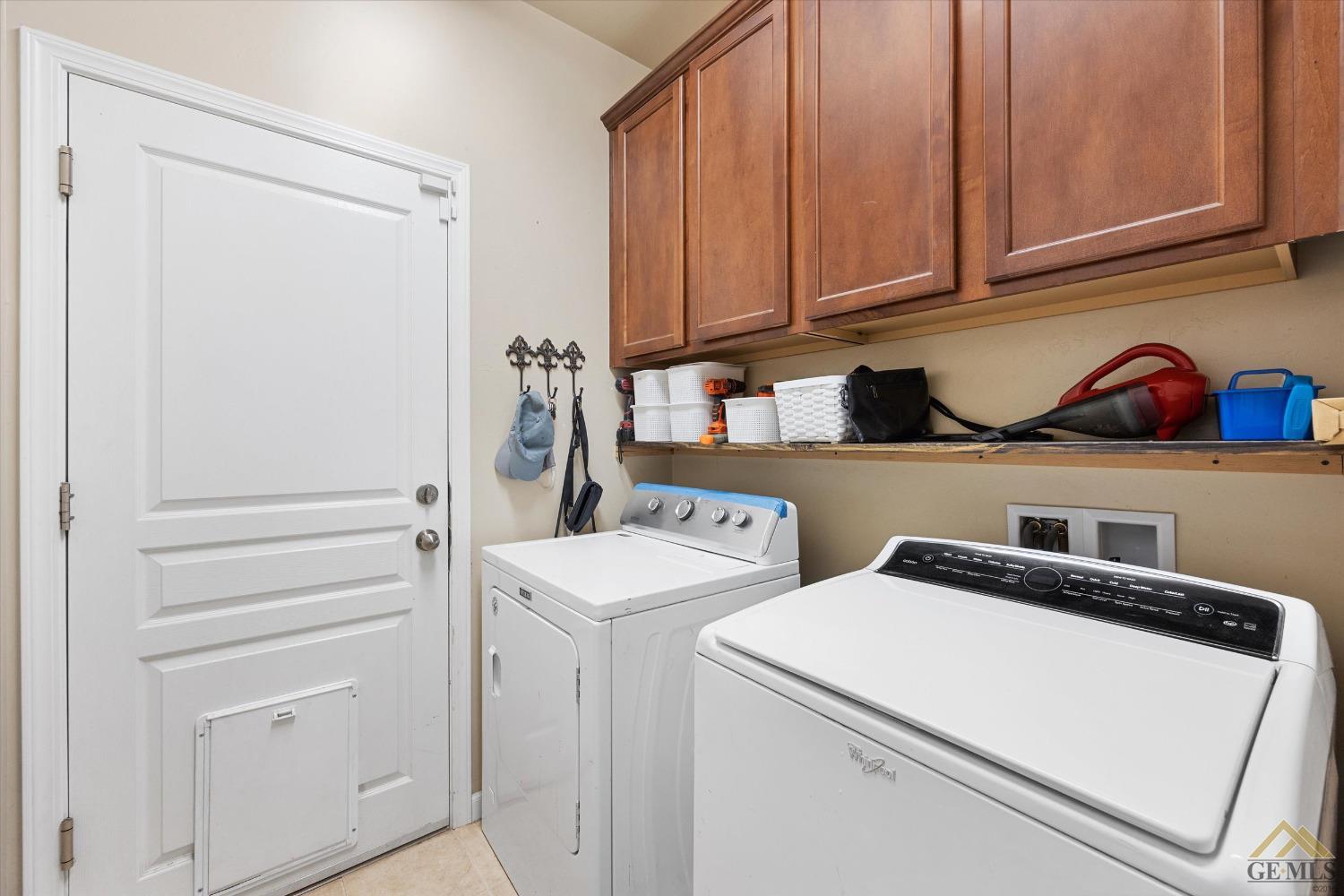 Undisclosed Address Bakersfield, CA 93314 - Photo 25 of 28 a utility room with dryer and washer