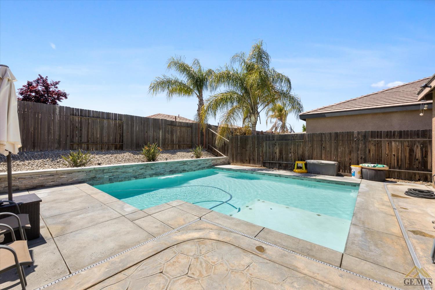 Undisclosed Address Bakersfield, CA 93314 - Photo 27 of 28 a view of a backyard and a garden