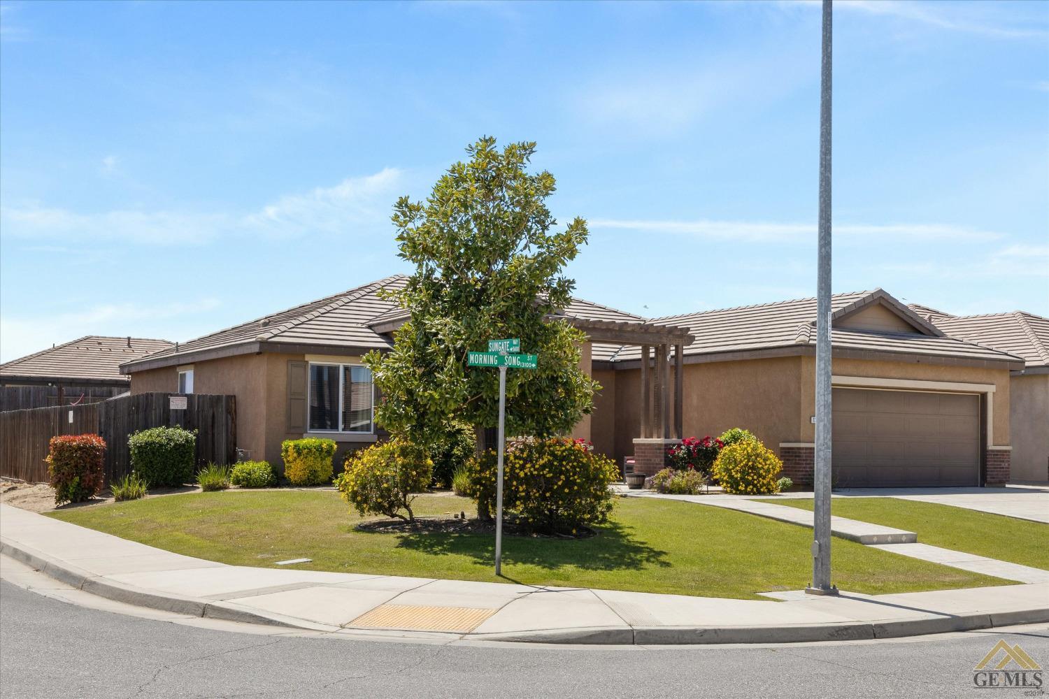 Undisclosed Address Bakersfield, CA 93314 - Photo 4 of 28 a front view of a house with garden