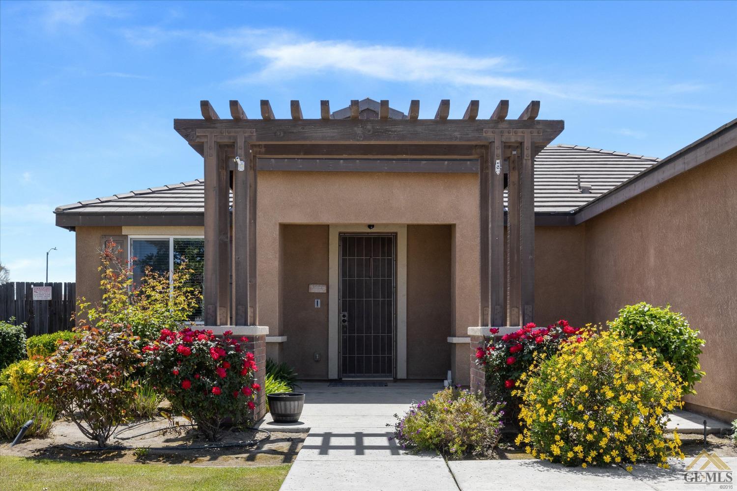 Undisclosed Address Bakersfield, CA 93314 - Photo 5 of 28 a view of a house with a flower garden