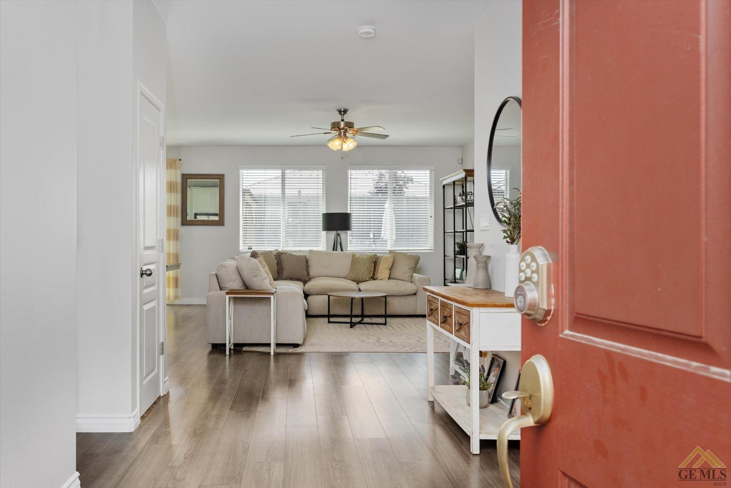 Undisclosed Address Bakersfield, CA 93314 - Photo 6 of 28 a living room with furniture and wooden floor