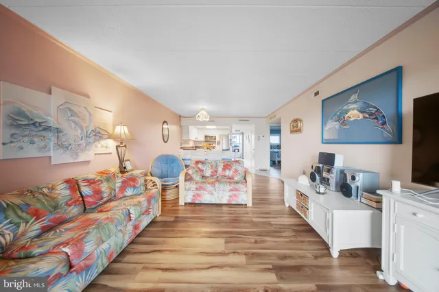 a living room with furniture and flat screen tv