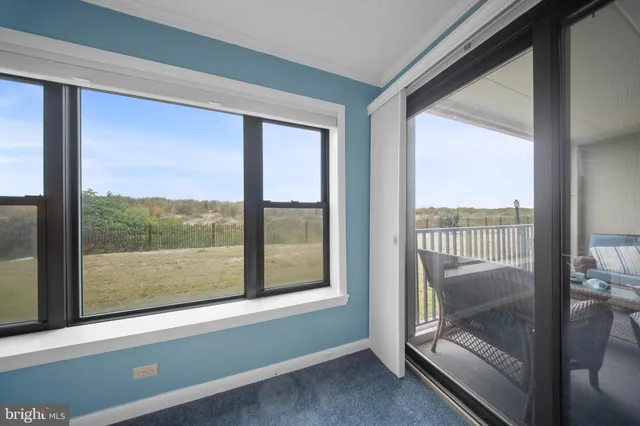 a view of a room with balcony and furniture