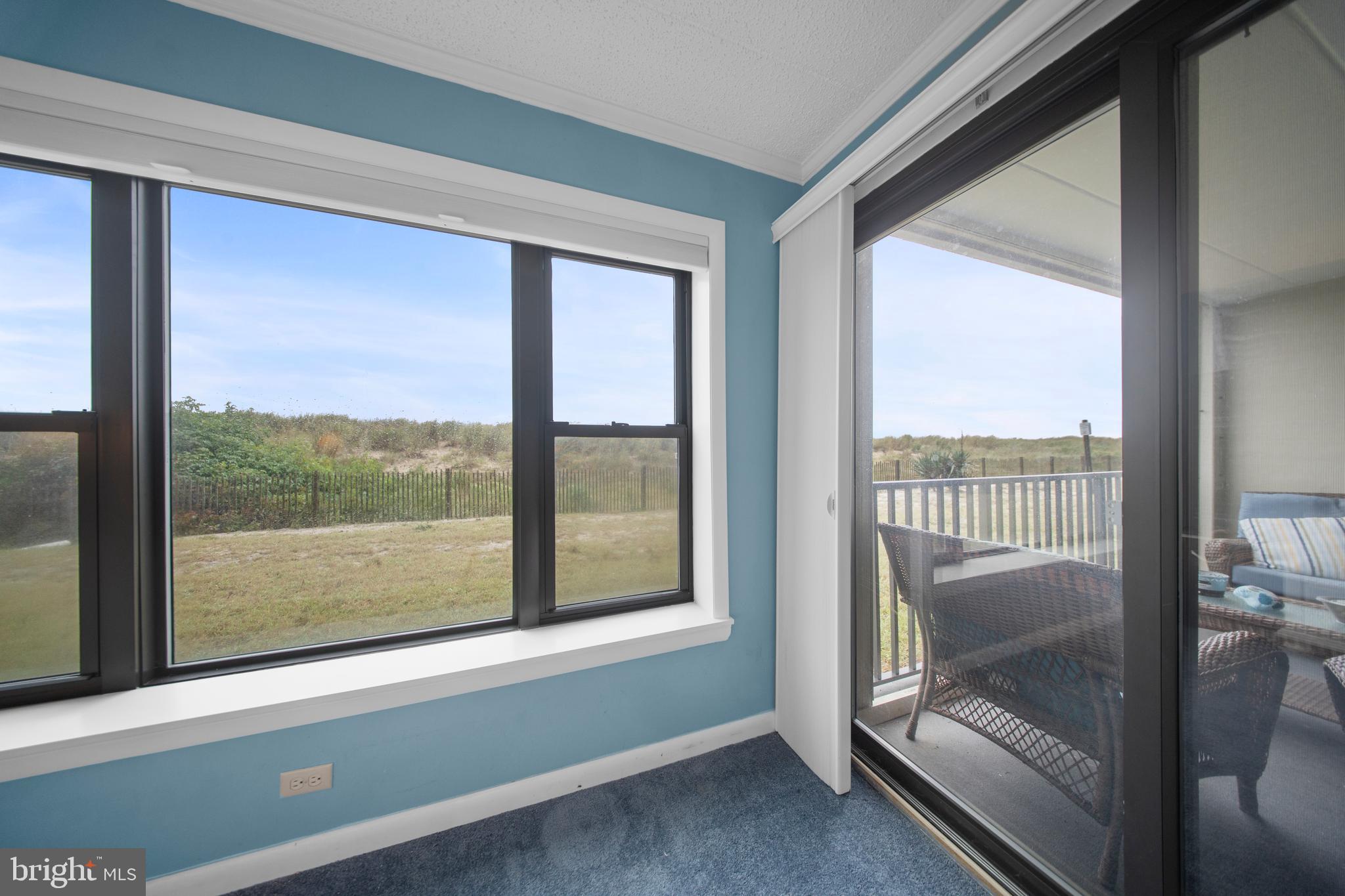 5505 Atlantic Avenue, Unit 107 Ocean City, MD 21842 - Photo 19 of 25 a view of a room with balcony and furniture