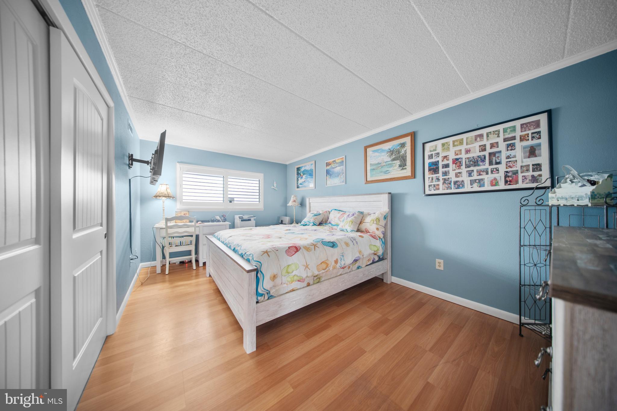 5505 Atlantic Avenue, Unit 107 Ocean City, MD 21842 - Photo 20 of 25 a bedroom with a bed and a walk in closet