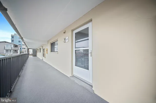 a view of a hallway with an entryway