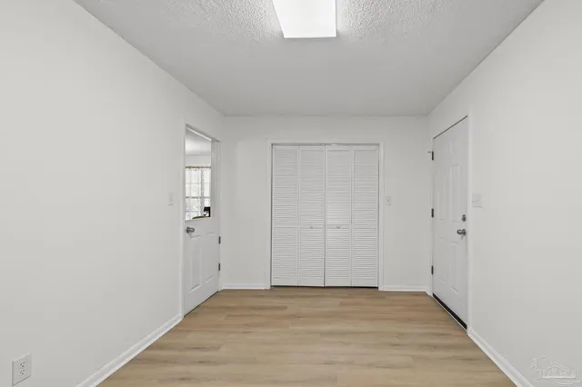 a kitchen with stainless steel appliances a sink a stove top oven a counter space and cabinets