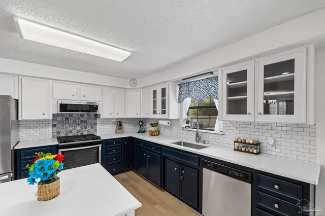 a kitchen with a sink and a cabinets