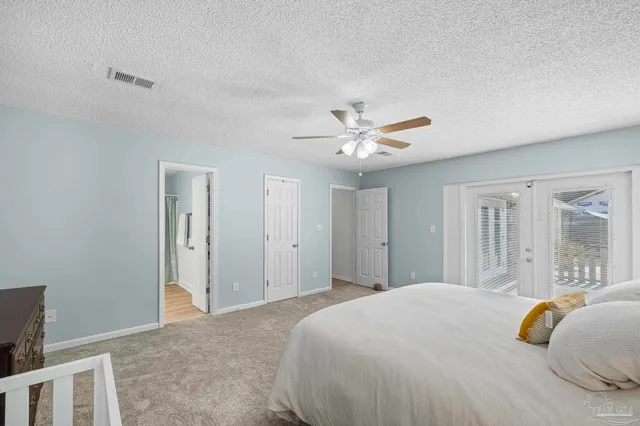 a spacious bathroom with a double vanity sink mirror and toilet