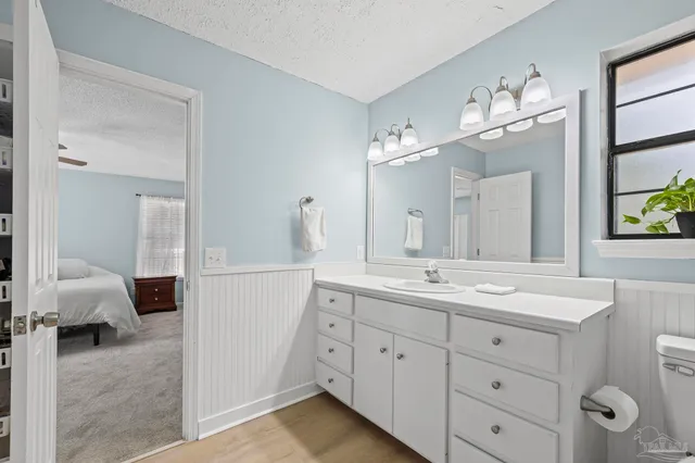a bedroom with furniture and a book shelf