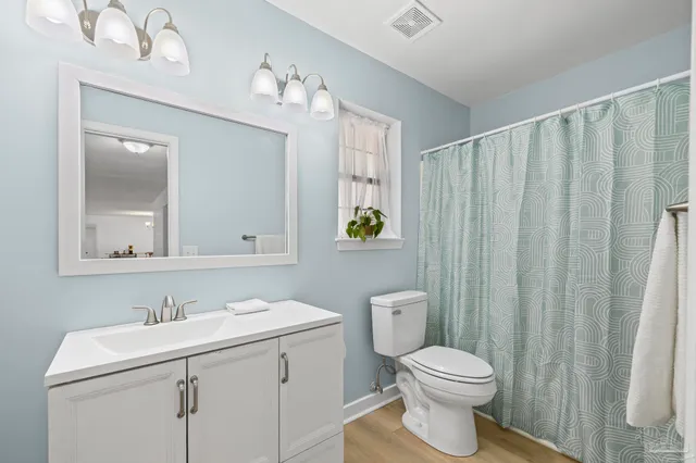 a front view of a house with large windows