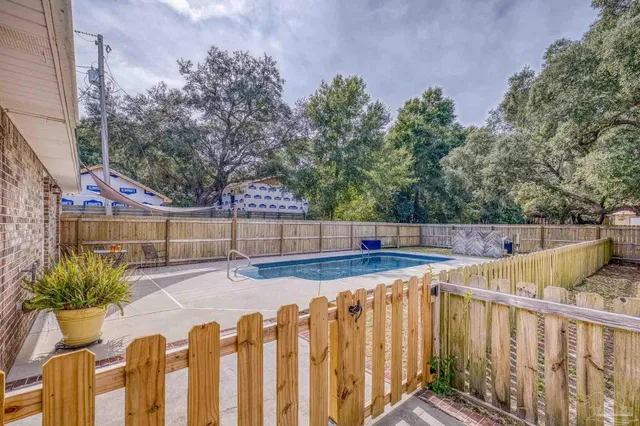 a view of a chairs and table on the wooden floor