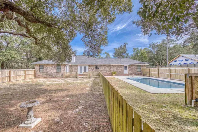 a view of a tree in front of a house