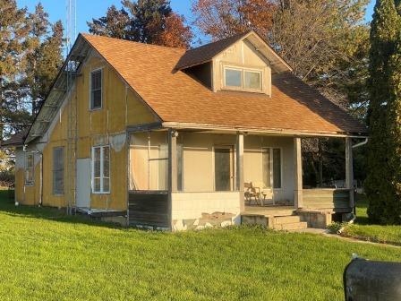 1184 Lost Nation Road Dixon, IL 61021 - Photo 1 of 14 a front view of a house with a yard