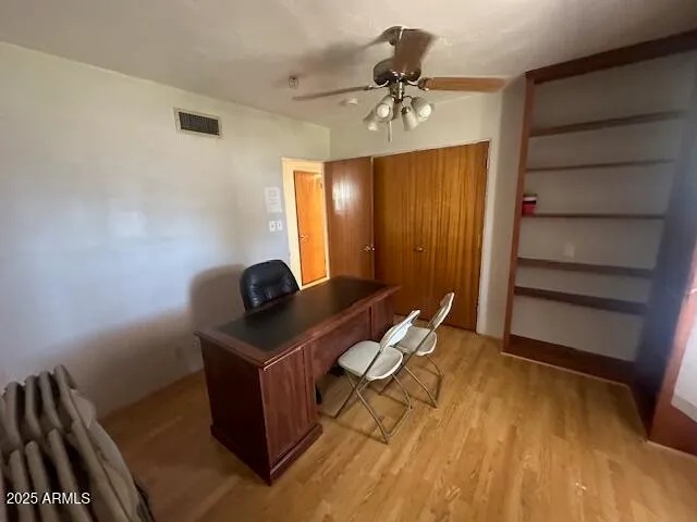 a view of workspace with wooden floor
