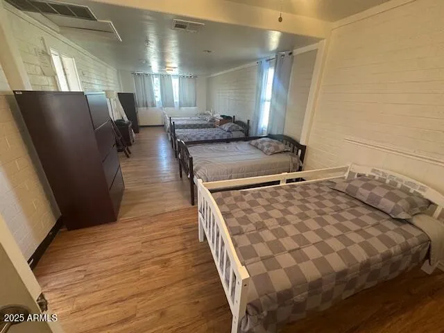 a bedroom with a bed and mirror