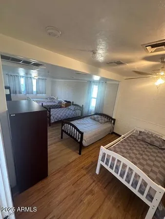 a living room with hard wood flooring and a couch