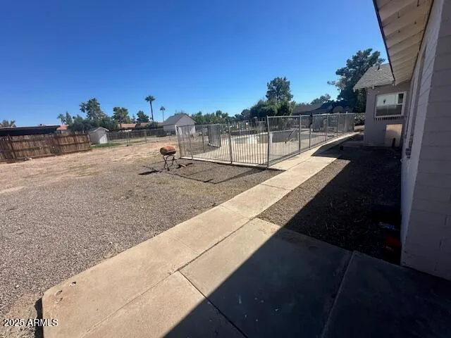 a view of a swimming pool with an outdoor seating