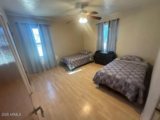 a bedroom with bed and window