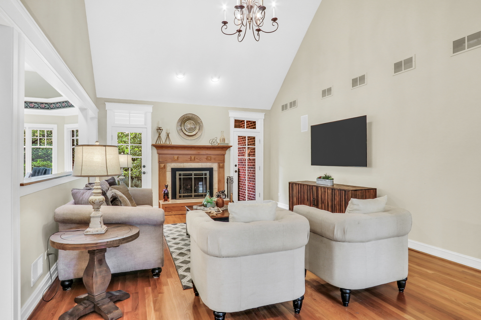 5684 Wolf Road Western Springs, IL 60558 - Photo 12 of 51 a living room with furniture a fireplace and a flat screen tv