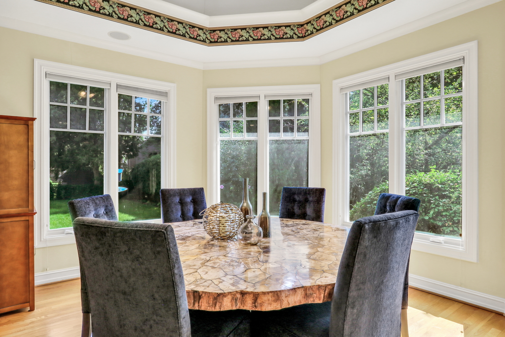 5684 Wolf Road Western Springs, IL 60558 - Photo 24 of 51 a view of a dining room with furniture window and wooden floor