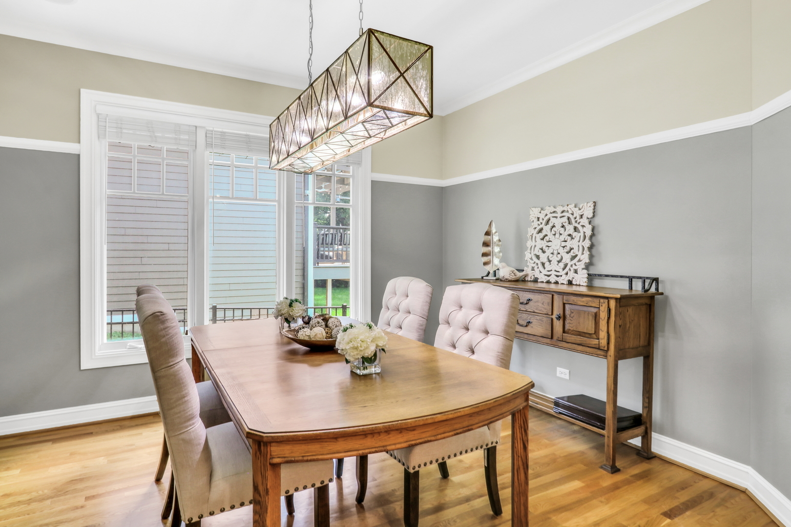 5684 Wolf Road Western Springs, IL 60558 - Photo 10 of 51 a view of a dining room with furniture wooden floor and chandelier
