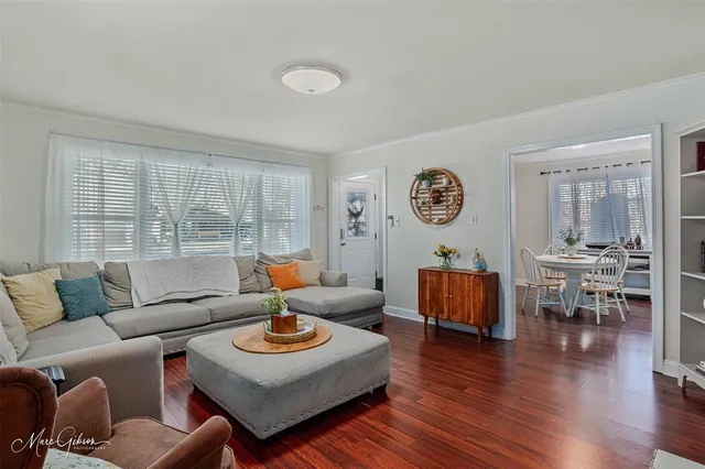 a living room with furniture and a table