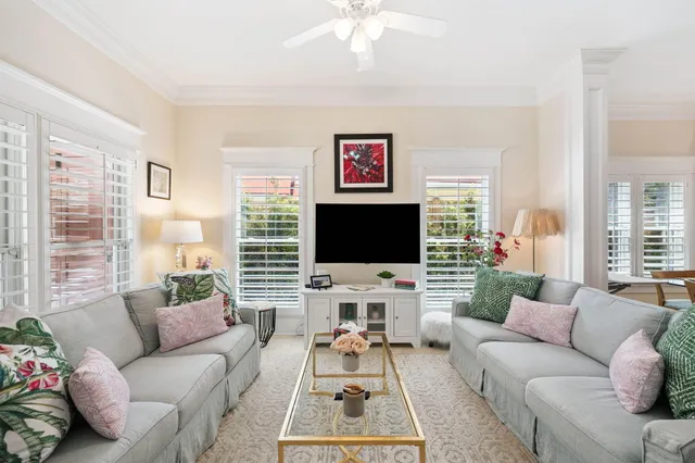 a bedroom with two beds and a lamp