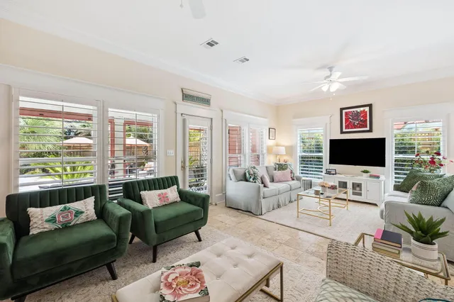 a view of a hallway with wooden floor and stairs