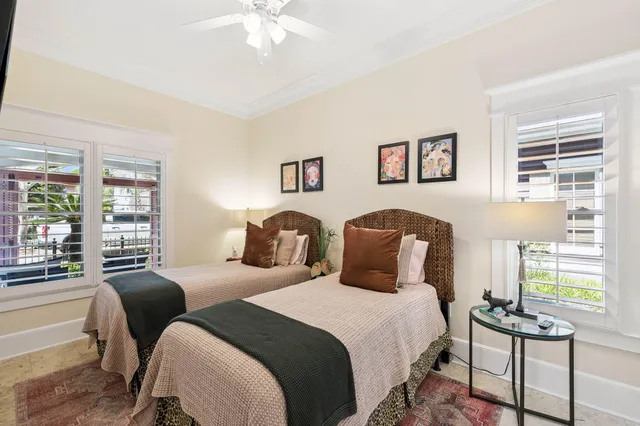 a view of walk in closet with clothes