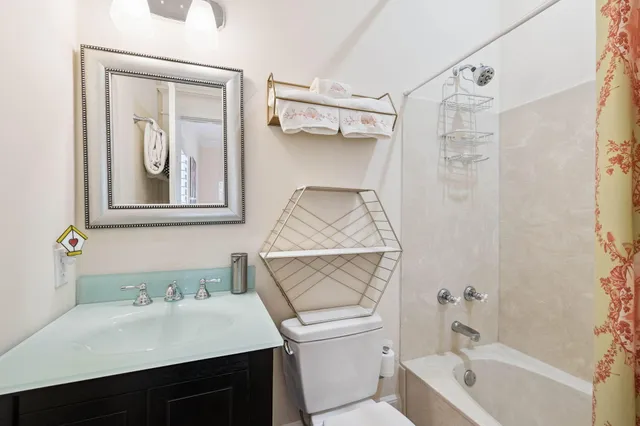 a view of a patio with couches chairs under an umbrella