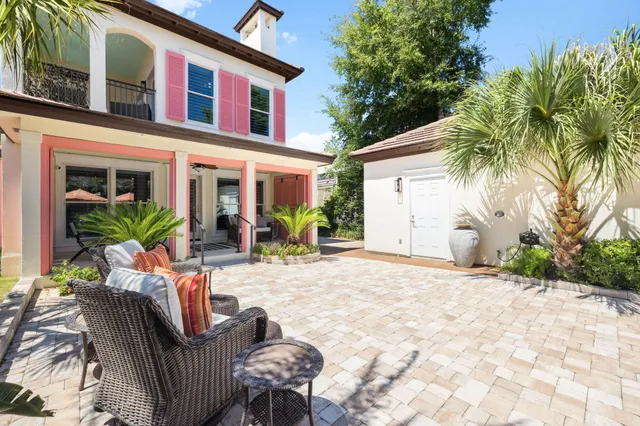 an aerial view of multiple houses with yard