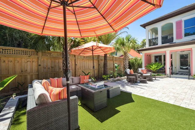 an aerial view of residential houses with outdoor space and street view