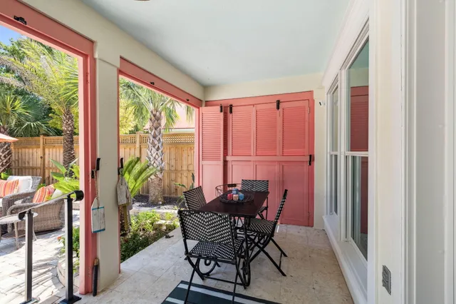 a house view with swimming pool and outdoor seating