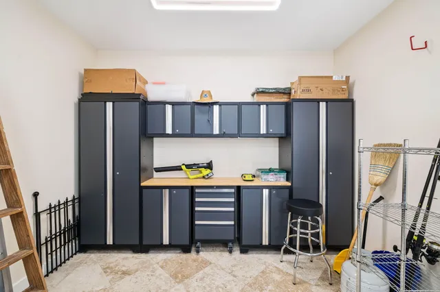 a view of a patio with table and chairs potted plants