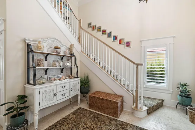 a kitchen with stainless steel appliances granite countertop a stove a sink dishwasher and cabinets with wooden floor